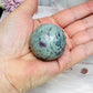 Ruby Fuchsite Sphere (UV Reactive) On Stand 92g