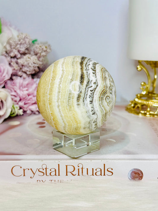 Natural Orange Calcite Sphere On Stand 350g