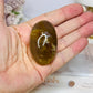 Golden Healer Palm Stone (stand is display only)