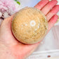 Gorgeous Large 478gram Peach Moonstone Sphere with Amazing Flash On Stand