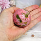 Thulite Sphere with Epidote 201g On Stand