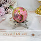 Thulite Sphere with Epidote 208g On Stand