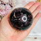 Large Garnet In Astrophyllite Sphere on Stand 532grams