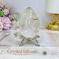 Large Clear Quartz Egg with Inclusions On Stand 7cm