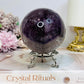 Large High Grade Phantom Amethyst Sphere with Rainbows On Stand 665g