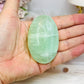 Pistachio Calcite Palm Stone (stand is display only)
