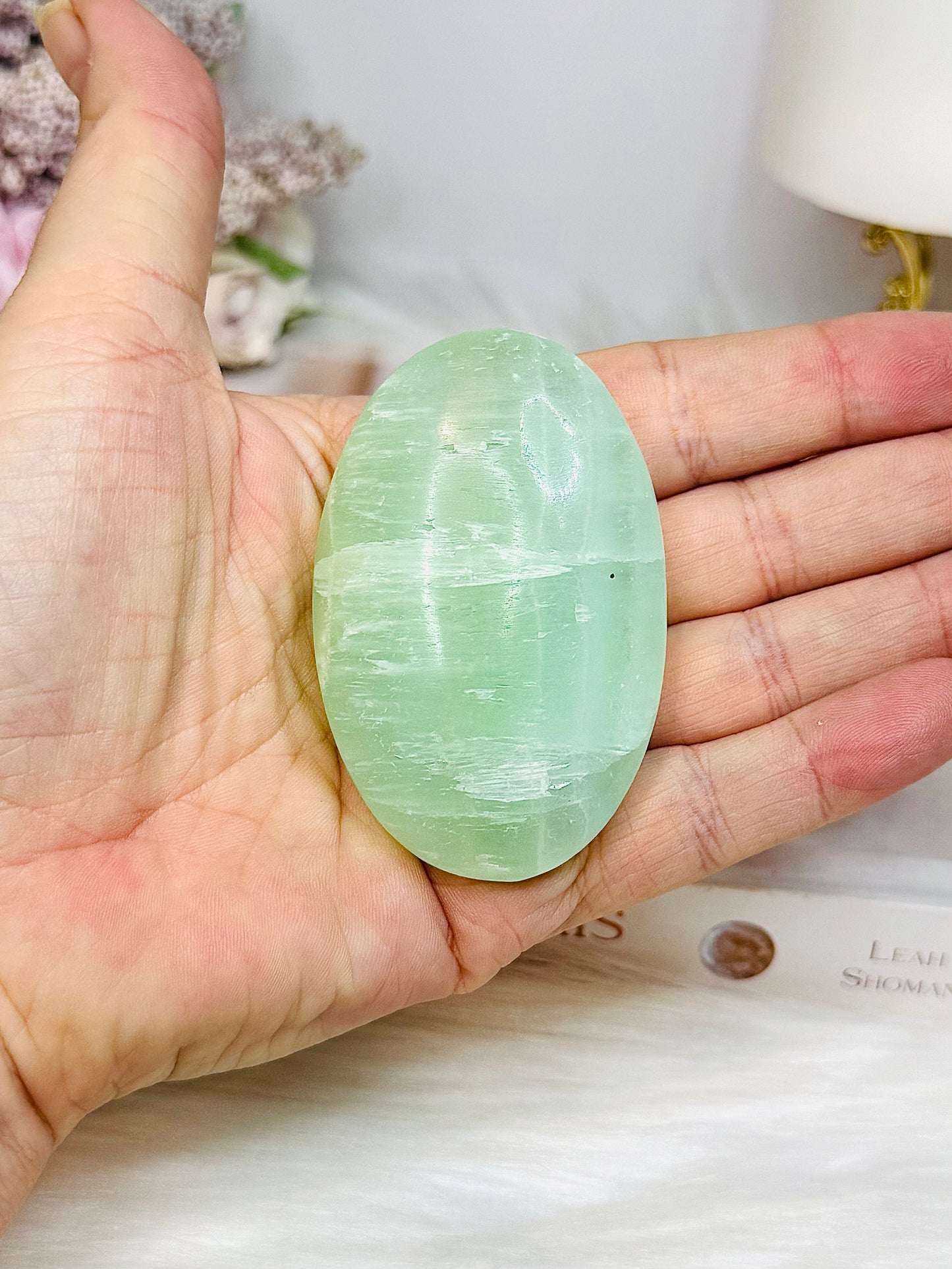 Pistachio Calcite Palm Stone (stand is display only)