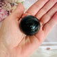 For Protection ~ Black Rainbow Obsidian Sphere on Timber Stand 7cm