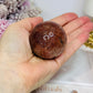 High Grade Sparkling Gold Sunstone X Moonstone Sphere on Stand 161g