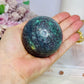 Ruby in Kyanite (UV Reactive) Sphere on Timber Stand 447g