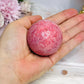 Thulite Sphere with Epidote 201g On Stand