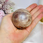 Shimmering Sunstone with Moonstone Sphere on Stand 250g