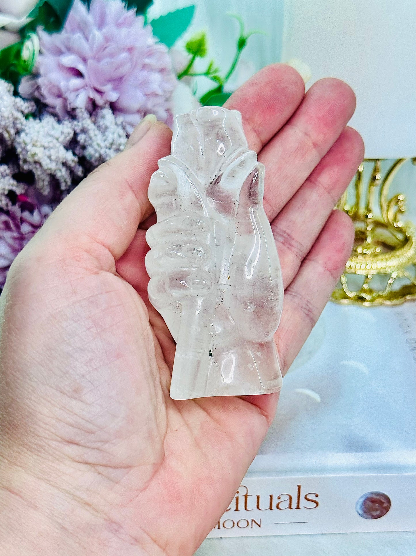 Perfectly Carved Clear Quartz Hand Holding A Rose