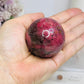 High Grade Rhodonite Sphere On Stand 200g