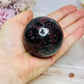 Garnet In Astrophyllite Sphere 282g On Stand