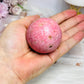 Thulite Sphere with Epidote 214g On Stand