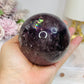 Large High Grade Phantom Amethyst Sphere with Rainbows On Stand 665g
