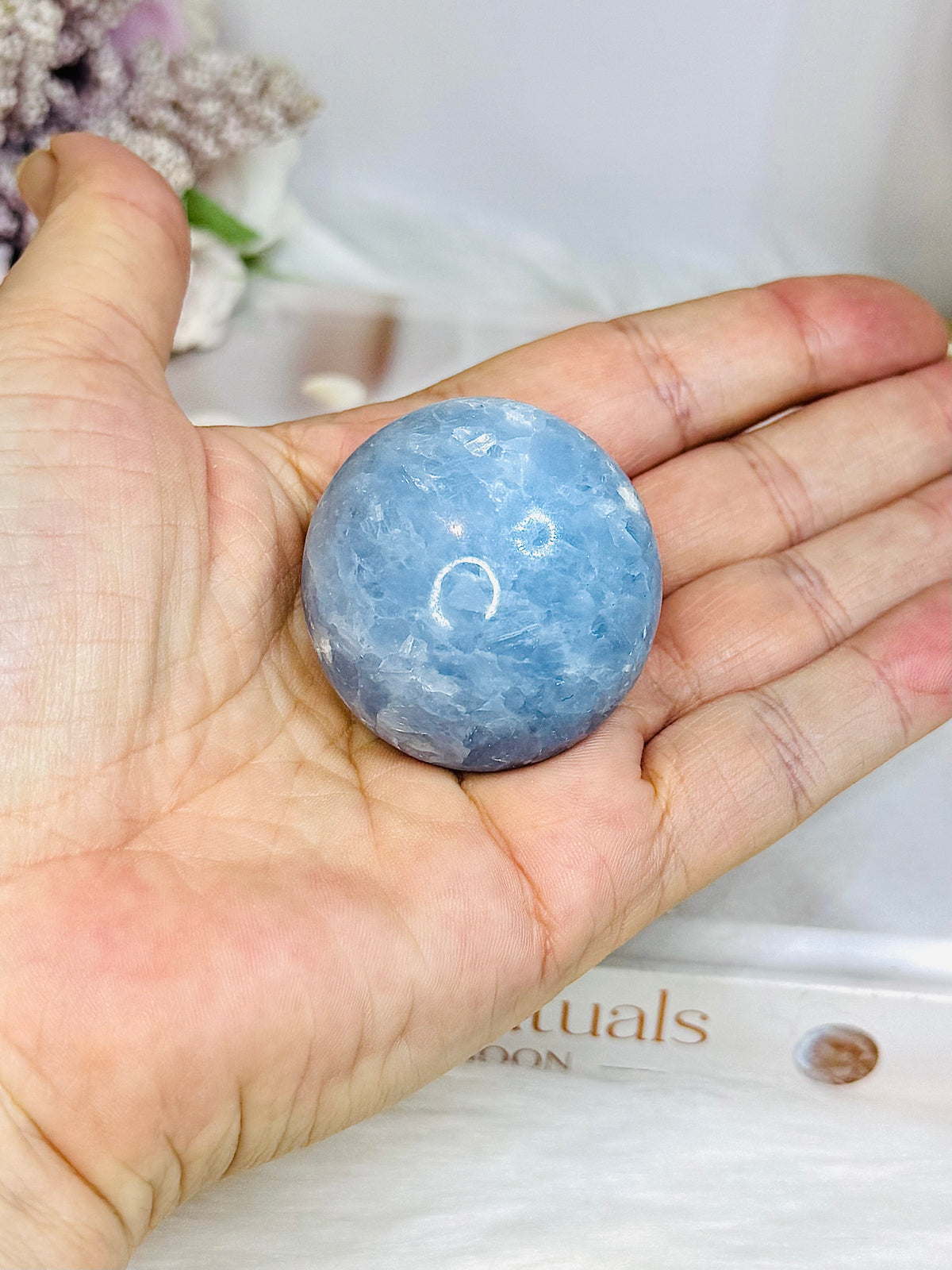 Blue Calcite Round Palm Stone (stand is display only)