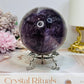 Large High Grade Phantom Amethyst Sphere with Rainbows On Stand 665g