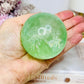 Green Fluorite Sphere with Rainbows On Stand 444g