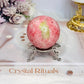 Thulite Sphere with Epidote 205g On Stand