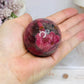 High Grade Rhodonite Sphere On Stand 200g