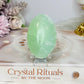 Pistachio Calcite Palm Stone (stand is display only)