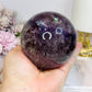 Large High Grade Phantom Amethyst Sphere with Rainbows On Stand 665g