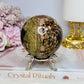 Large Rhodonite Sphere 561g On Stand