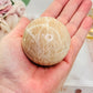 Peach Moonstone Sphere with Flash on Stand 223g