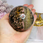 Large Rhodonite Sphere 561g On Stand