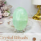 Pistachio Calcite Palm Stone (stand is display only)