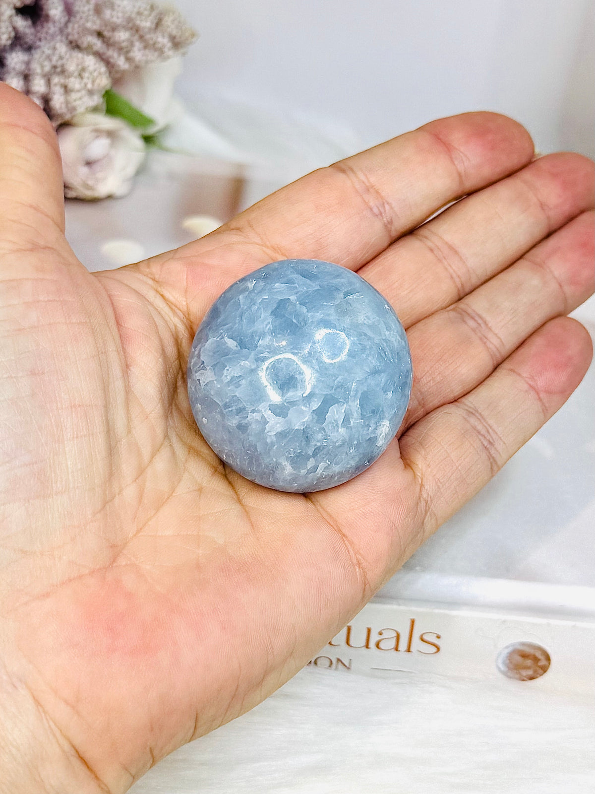 Blue Calcite Round Palm Stone (stand is display only)