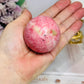 Thulite Sphere with Epidote 205g On Stand