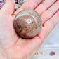 Pretty Rhodonite Sphere 174grams On Silver Stand