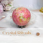 Thulite Sphere with Epidote 199g On Stand