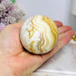 Orange Calcite Sphere on Stand 335g