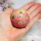 Thulite Sphere with Epidote 202g On Stand