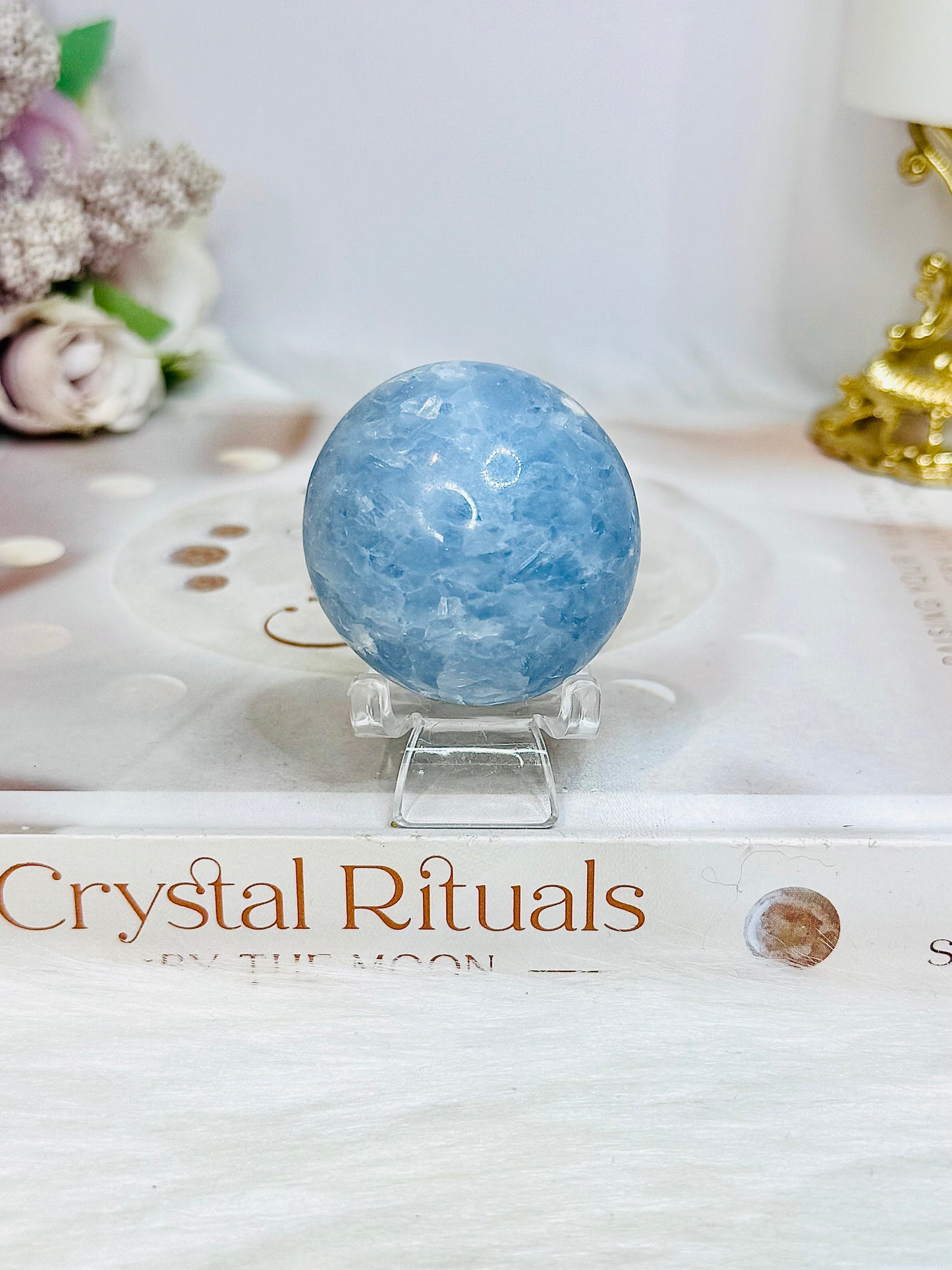 Blue Calcite Round Palm Stone (stand is display only)