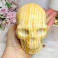 Large Orange Calcite Carved Skull 11.5cm 1.01KG
