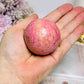Thulite Sphere with Epidote 202g On Stand