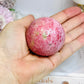 Thulite Sphere with Epidote 207g On Stand
