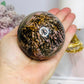 Large Rhodonite Sphere 561g On Stand