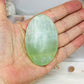 Pistachio Calcite Palm Stone (stand is display only)