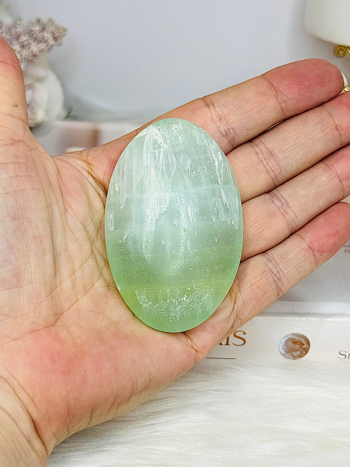 Pistachio Calcite Palm Stone (stand is display only)