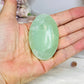 Pistachio Calcite Palm Stone (stand is display only)