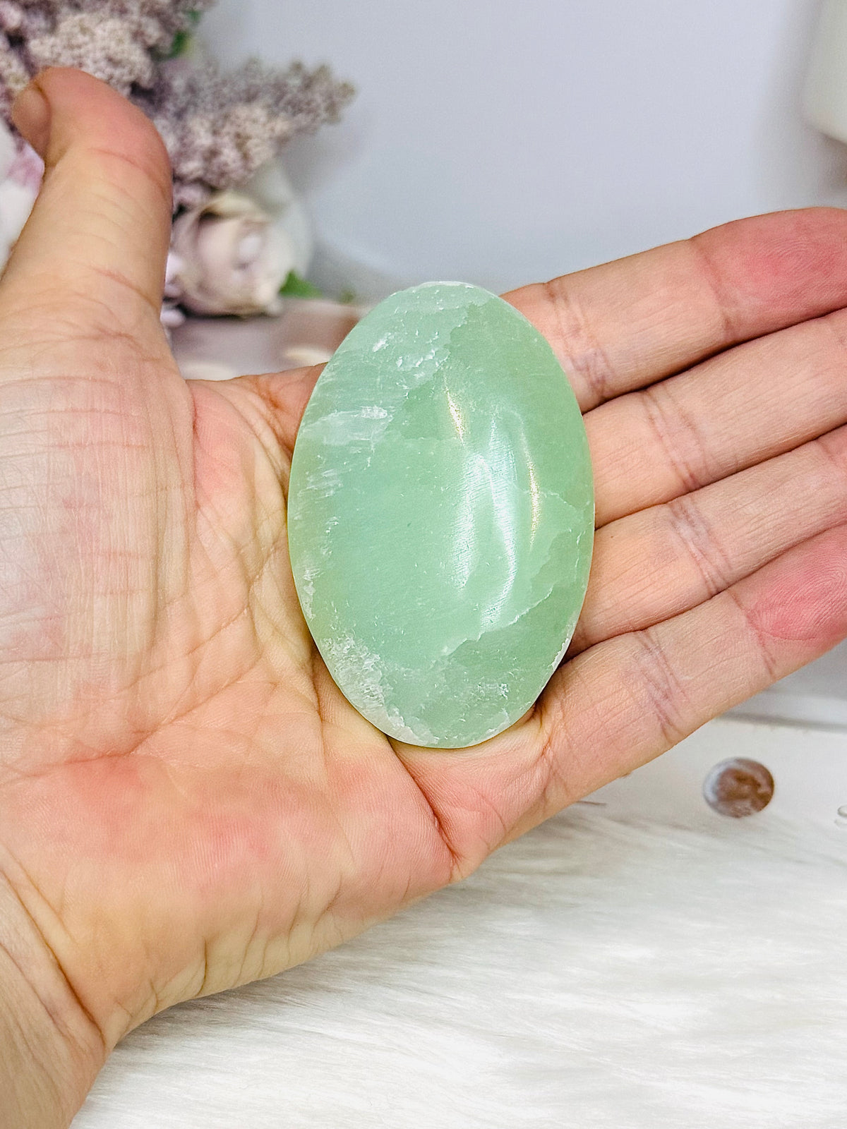 Pistachio Calcite Palm Stone (stand is display only)