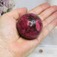 High Grade Rhodonite Sphere On Stand 200g