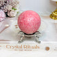 Thulite Sphere with Epidote 209g On Stand
