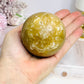 Large Amber Calcite Sphere on Stand 419g